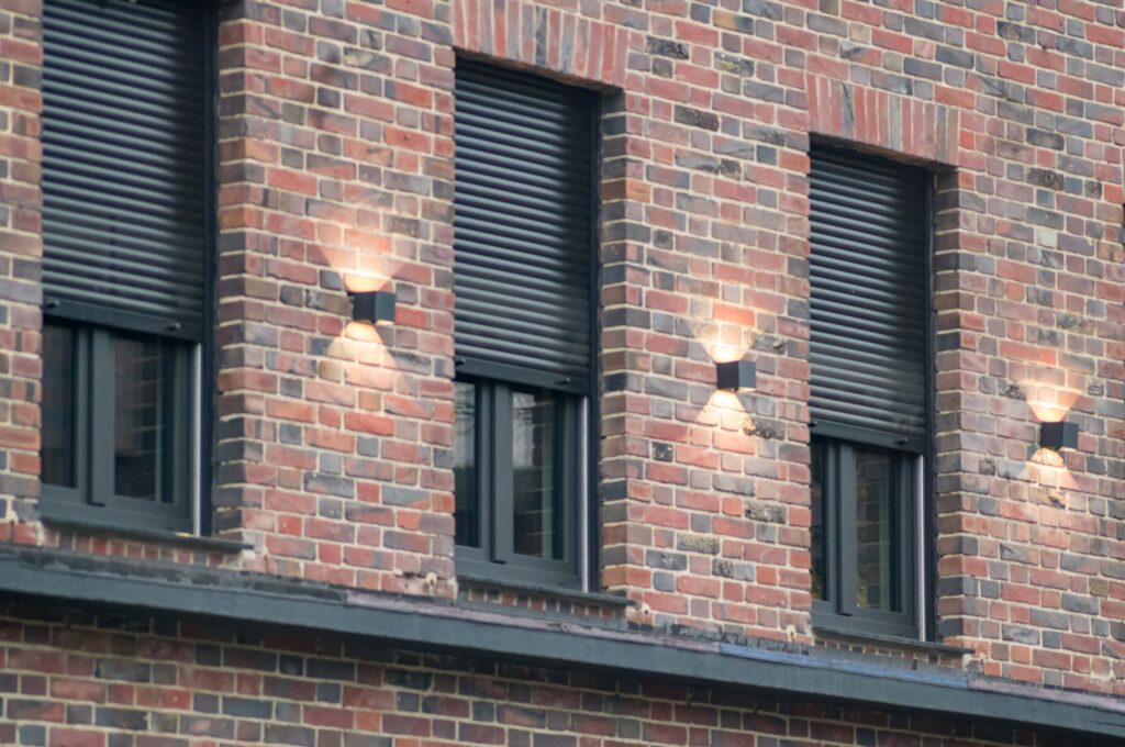 Secure shutters on windows on brick building
